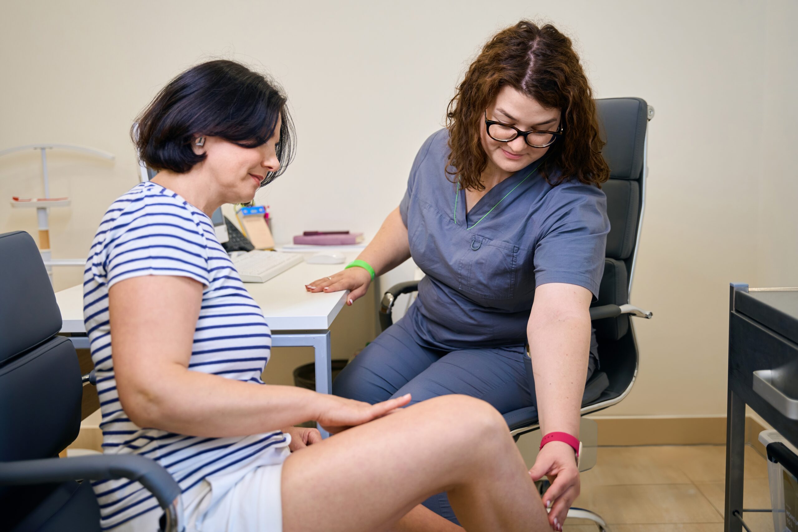 Patient having a consultation with her vein specialist to discuss if VenaSeal is right for her issues